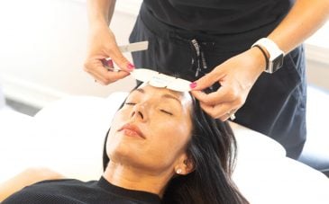 nurse applying face treatment